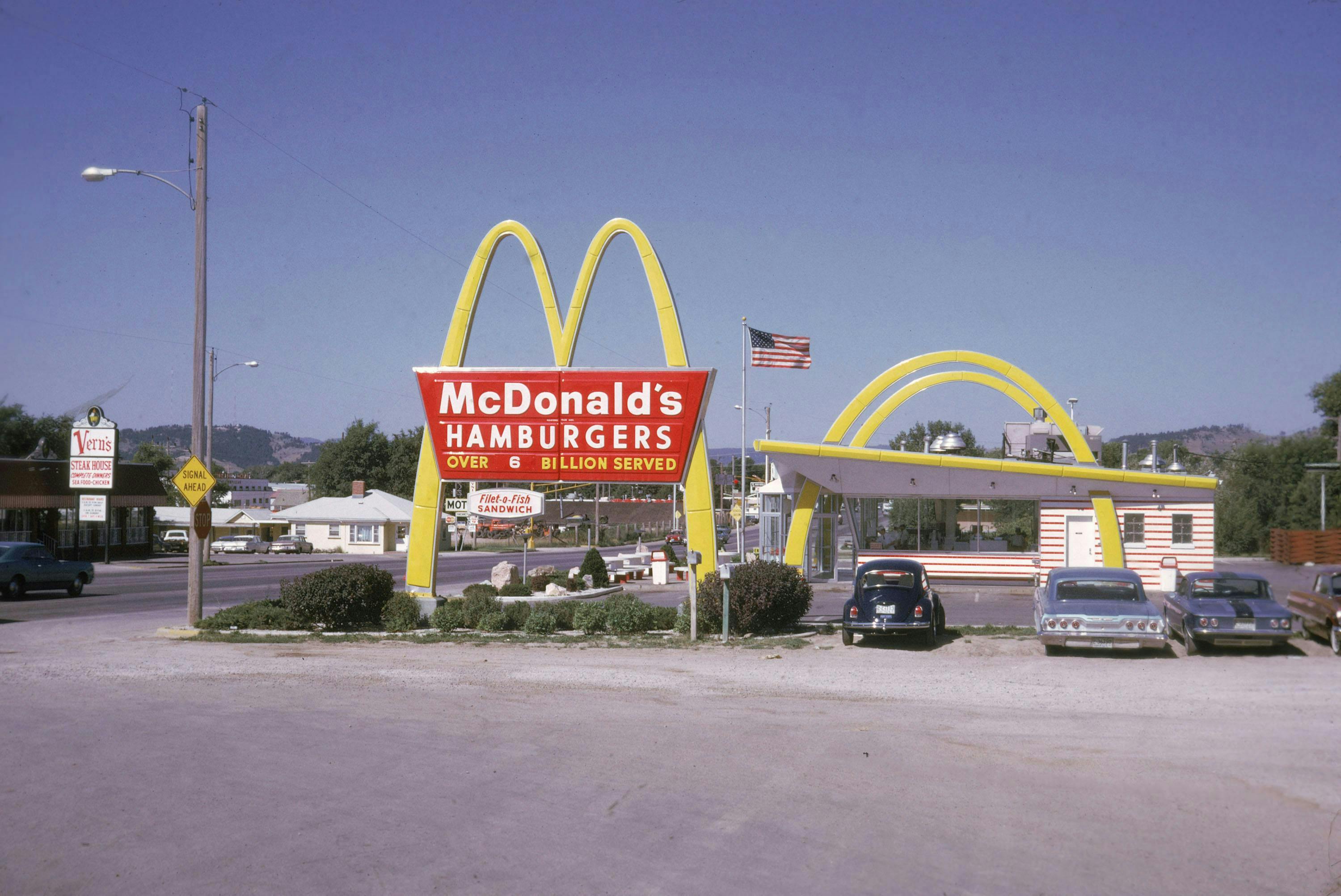 american culture t478325 t473825 sign road restaurant photograph food & drink flag eating out colour car brand name (ex gins 2407837) transportation vehicle automobile symbol tarmac asphalt