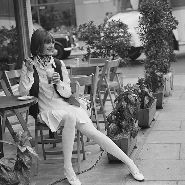 huty19726|huty 19726|black and white|1969|outdoors|day|exp 1969 2110|fashion model|one woman|full length|sitting|holding|drink|cafe|cafe terrace|huty1972615|cravat|scarf|hairstyle|tights|shoes|day dress|minidress|milkshake chair furniture clothing apparel restaurant person human cafe sitting