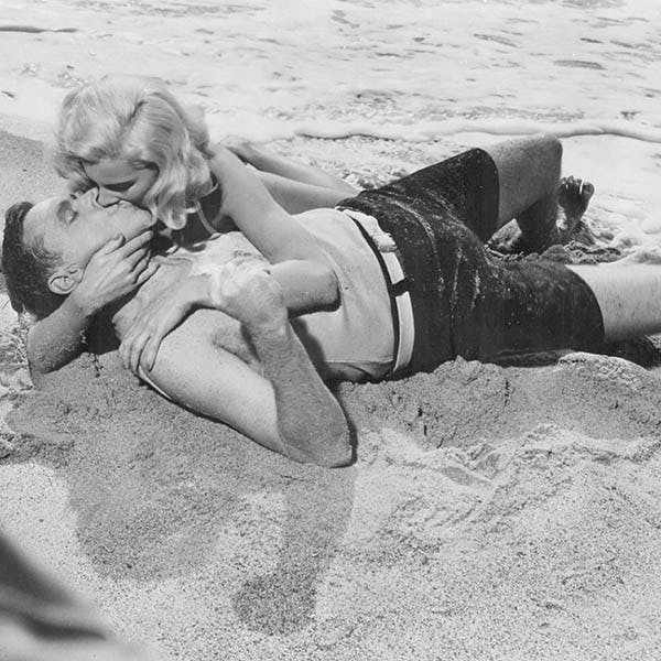 love;lust;black & white;format landscape;male;female;film;film actor;film actress;genre;comedy;personality;american;m 135036 box 957 5/4;m/cin/film/seven year itch; clothing apparel shorts sand nature outdoors person human face