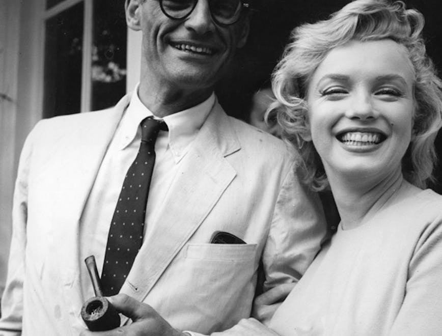 format square;pipe;male;female;couple;film;film actress;the stage;playwright;personality;american;es c 2811;es p/monroe/marilyn tie accessories person human clothing glasses suit coat overcoat shirt