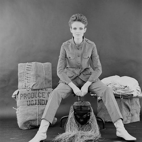 black & white huty20124 1967 exp 1967 936 fr 11 one woman only full length indoors eye contact posed backdrop mask - disguise sack prop person human clothing apparel sitting