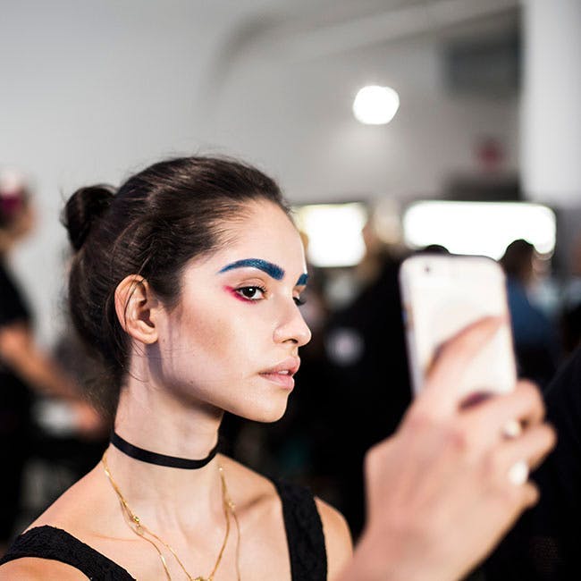 catwalk runway backstage designer fashion model new york ny face person human mobile phone cell phone phone electronics