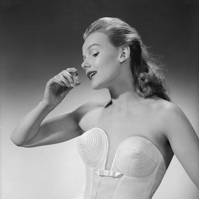 black & white format portrait female bottle perfume fashion & clothing cha 3510-9 m/clo/1950-59/unde clothing apparel person human lingerie underwear