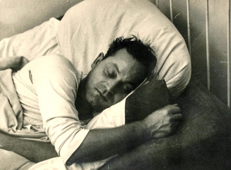 "black & white" "found photograph" "laying down" antique bed man monochrome old photograph sleeping snapshot vernacular vintage pillow cushion asleep person human furniture hug