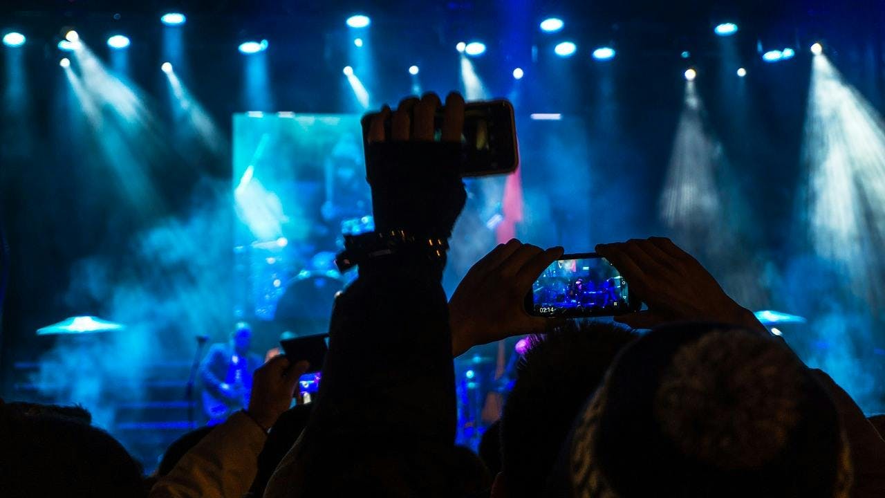 person human crowd lighting concert rock concert