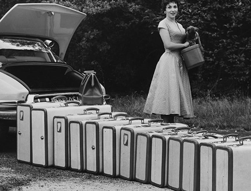 black & white;format landscape;female;collection of objects;luggage;suitcase;vehicle;car;film;film actress;personality;road transport;italian;m 140227 no neg;m/cin/port/lollobrigida/gina person human car transportation vehicle automobile