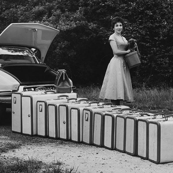 black & white;format landscape;female;collection of objects;luggage;suitcase;vehicle;car;film;film actress;personality;road transport;italian;m 140227 no neg;m/cin/port/lollobrigida/gina person human car transportation vehicle automobile