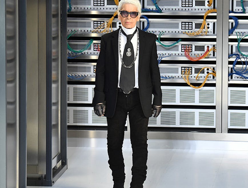 catwalk paris clothing apparel person human suit coat overcoat sunglasses accessories accessory