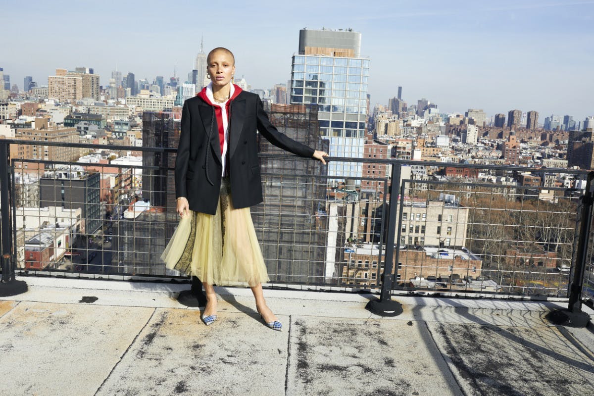 clothing metropolis urban city building coat high rise person female suit