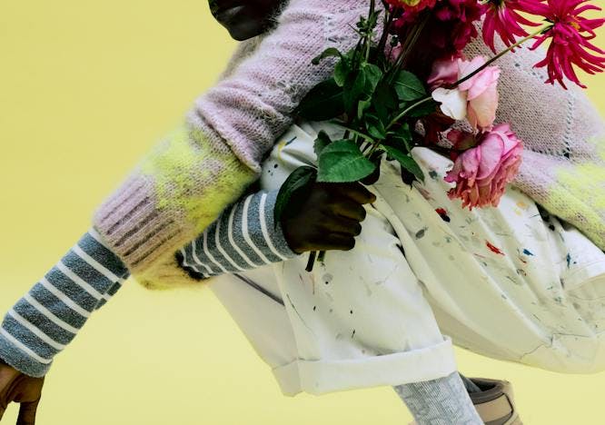 person human plant flower bouquet flower flower arrangement blossom shoe clothing footwear