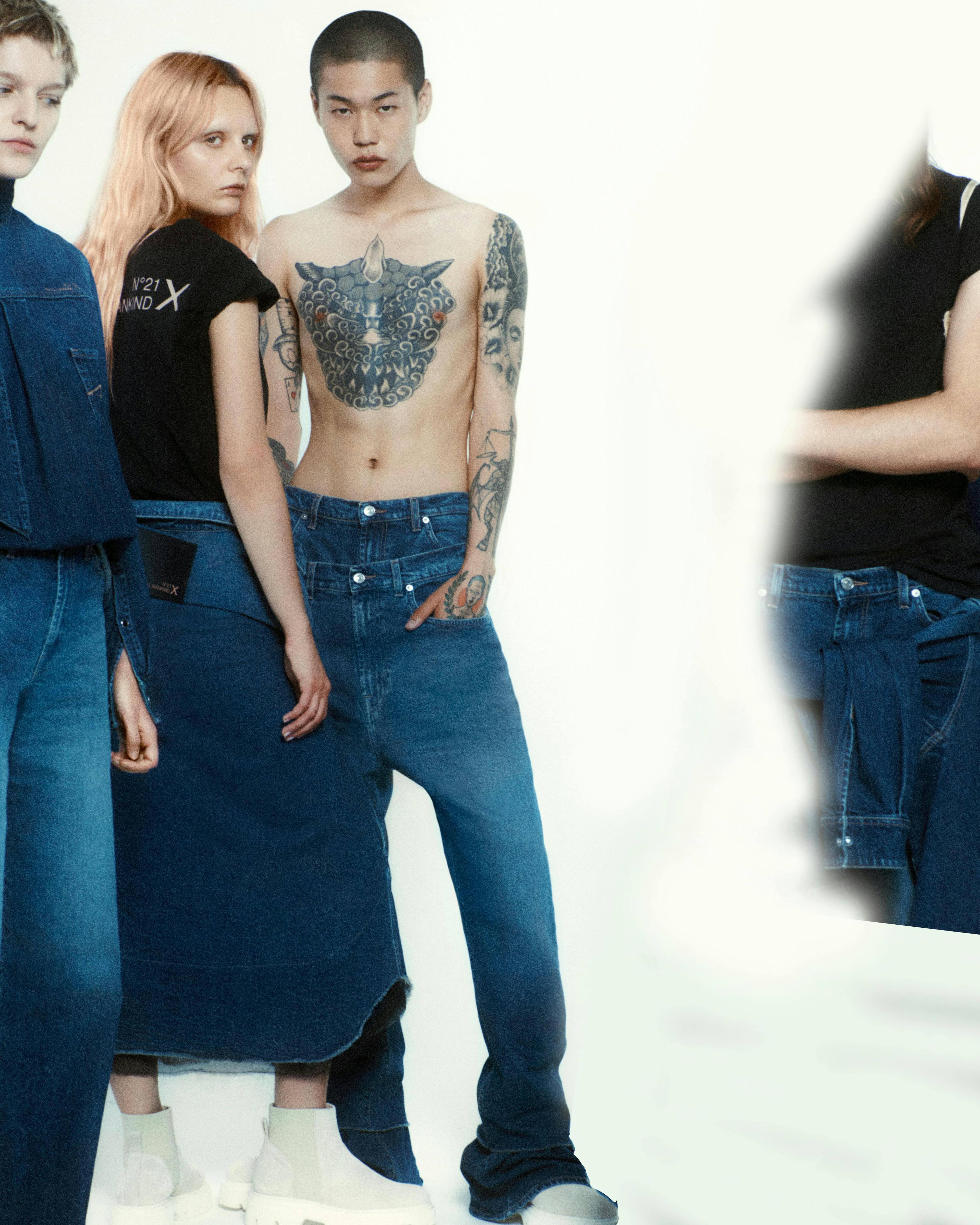 skin pants clothing apparel person human jeans denim sleeve tattoo