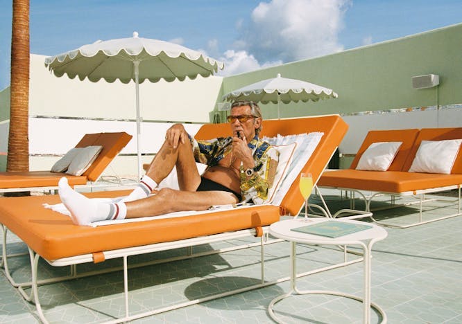 person man adult male sunbathing sock hosiery clothing glasses accessories